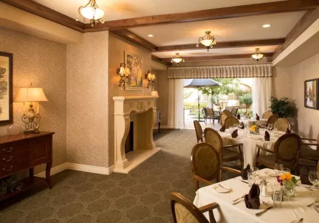 Dining room with fireplace and view to terrace