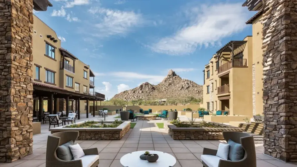 Bright and inviting outdoor space offering stunning mountain views, perfect for community gatherings., Cadence Lakewood