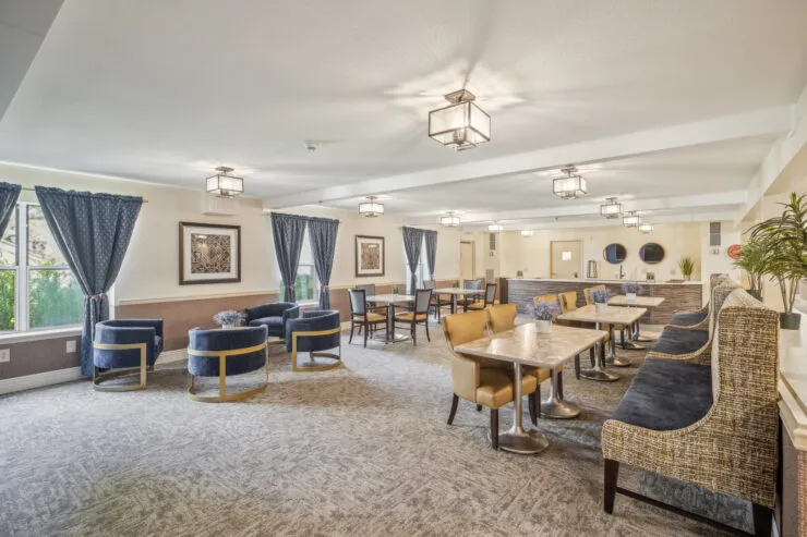 Bright, inviting dining area with comfortable seating fostering community and relaxation., Harvard Square Memory Care