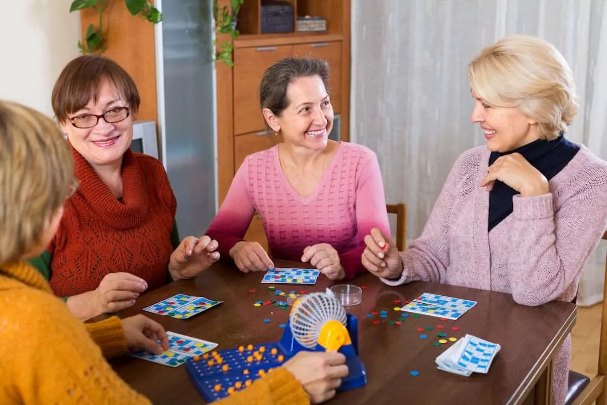 Pegasus Senior Living | Seniors playing bingo together, The Legacy at Long Meadow, Assisted Living in Richmond, TX