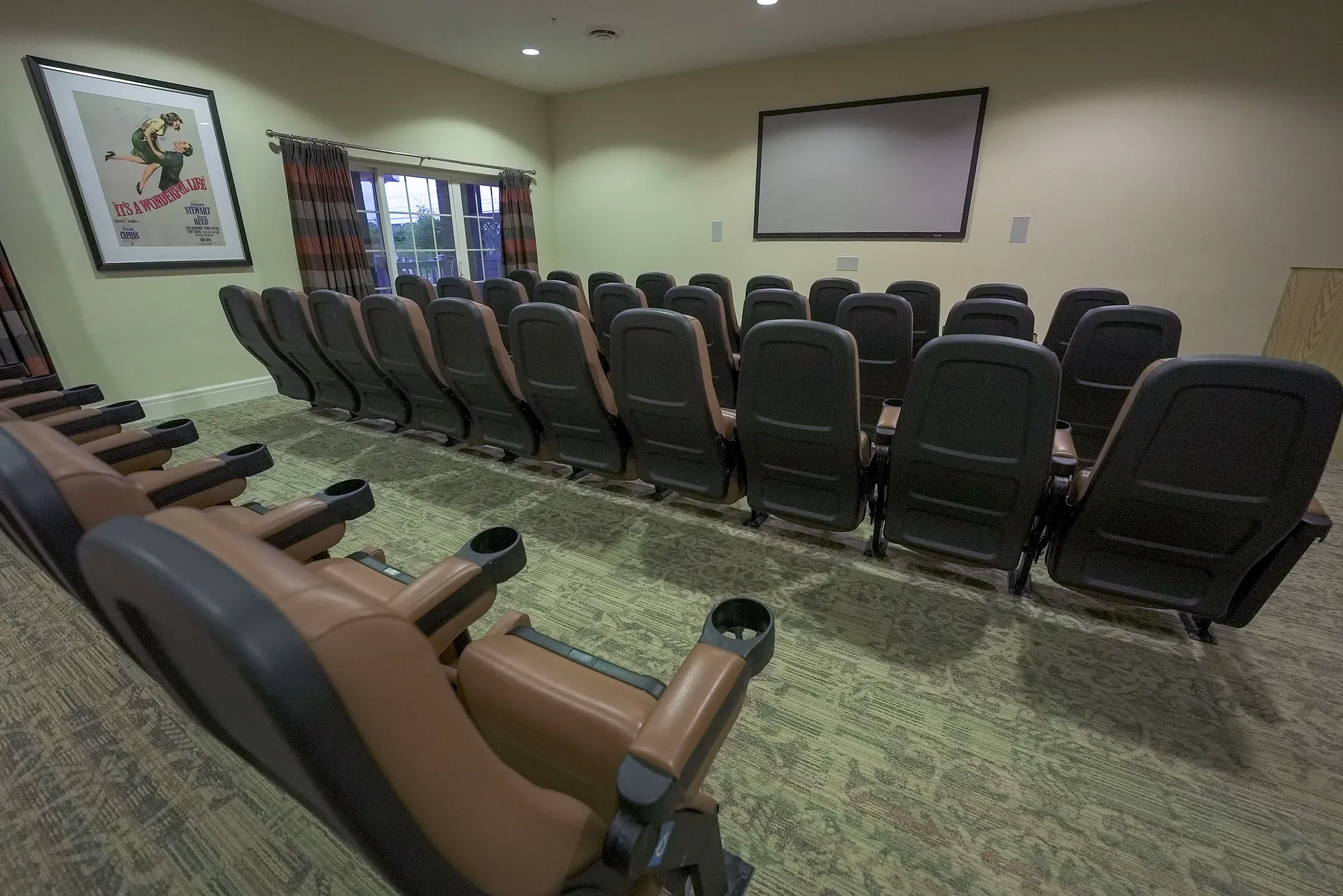 Small home theater with rows of reclining seats, Harmony at Chantilly, Assisted Living in Herndon, VA